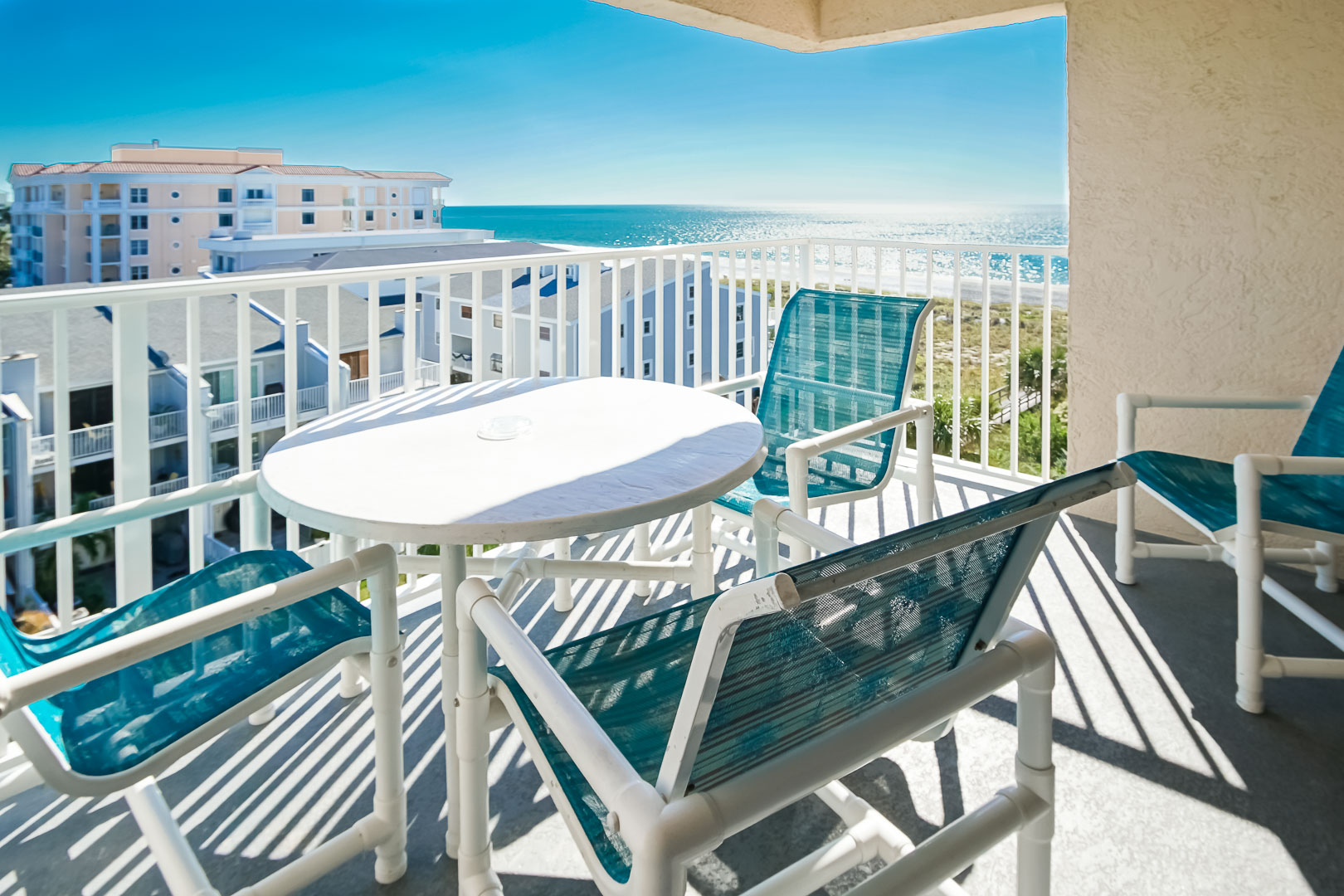 A balcony with an ocean view at VRI's Sand Pebble Resort in Treasure Island, Florida.